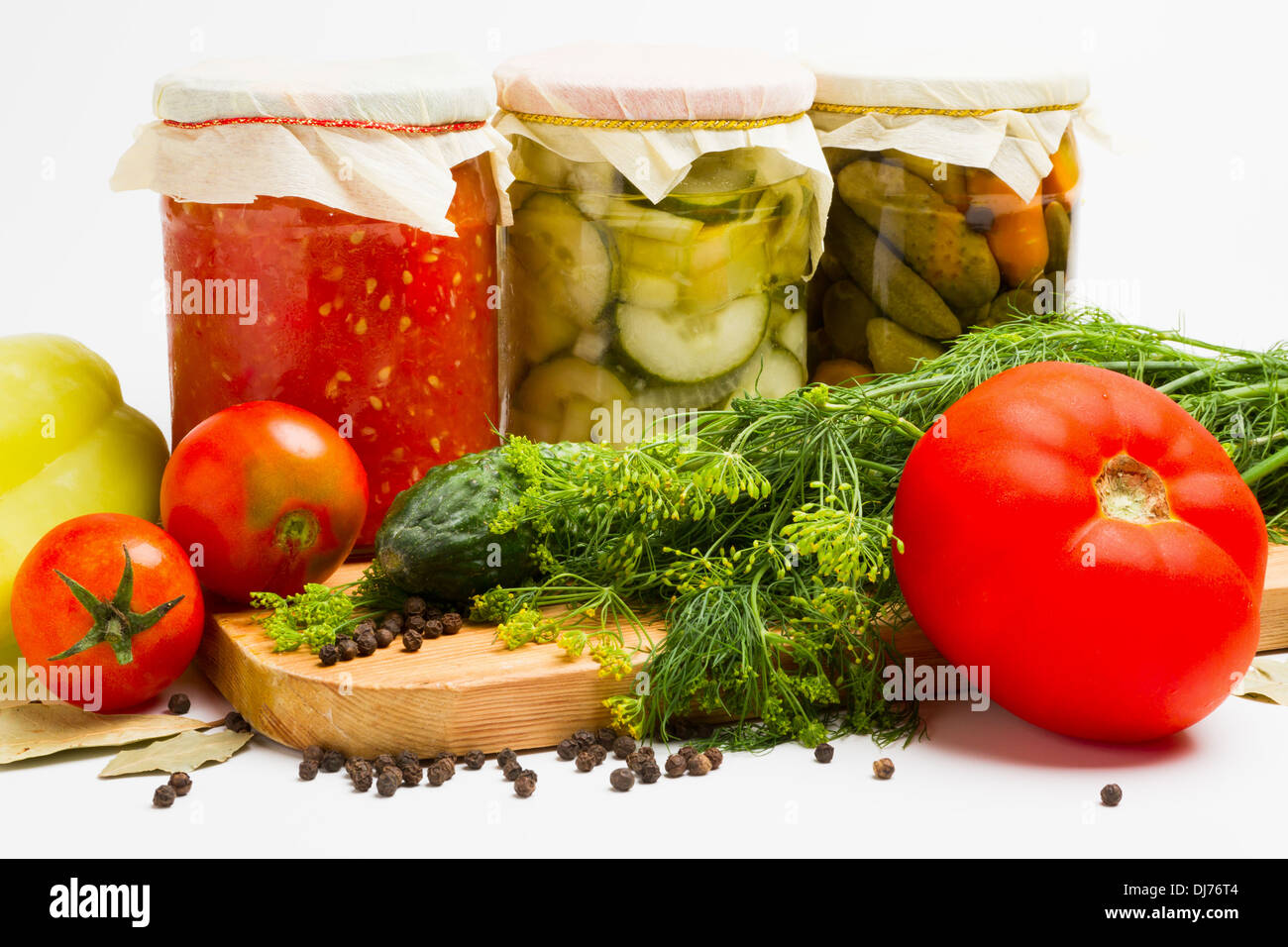 jars of pickled vegetables. Marinated cucumber, tomato, zucchini Stock Photo