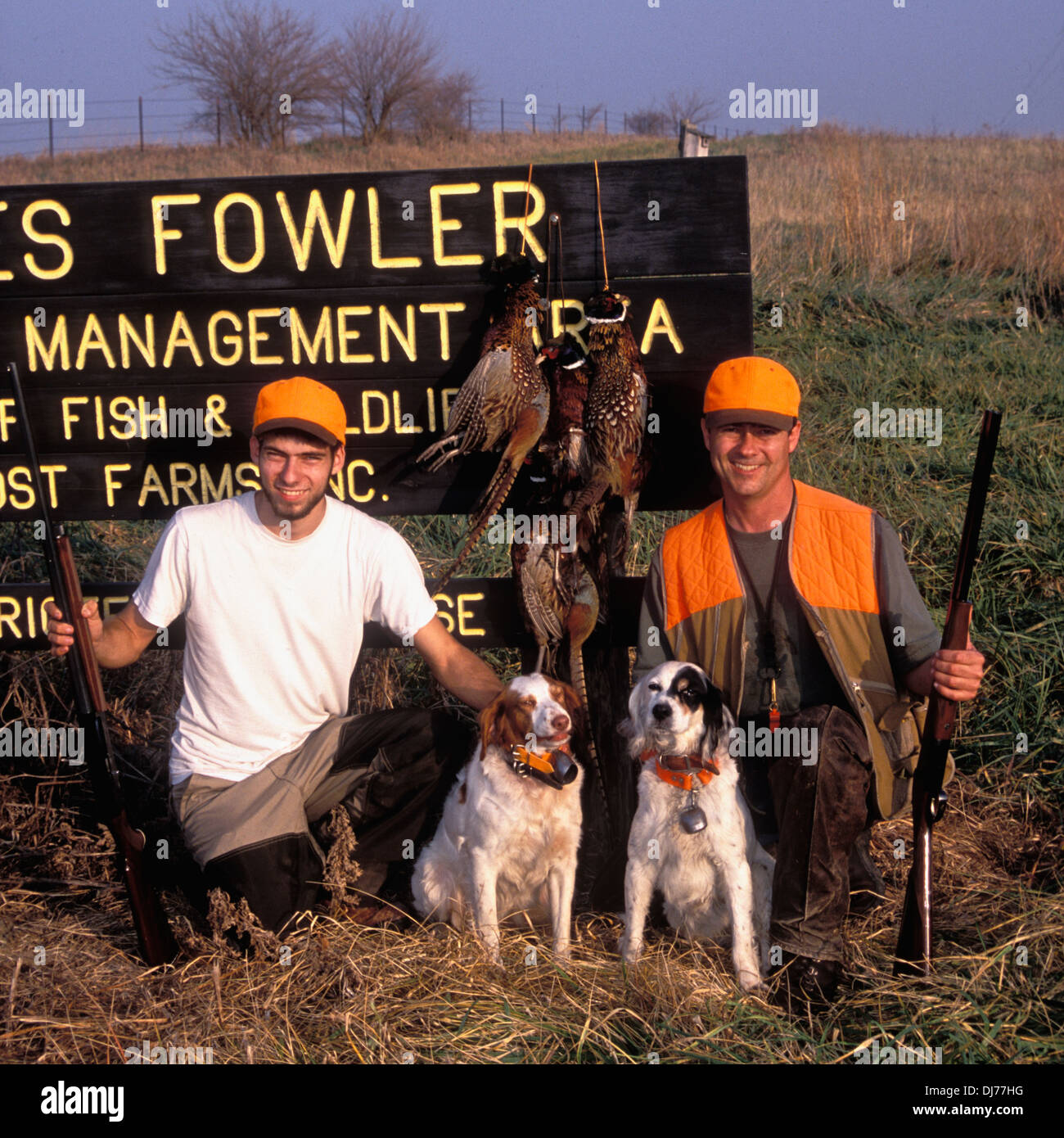 Father and Son Posing with Pheasants after Successful Bird Hunt in Northern Indiana Stock Photo