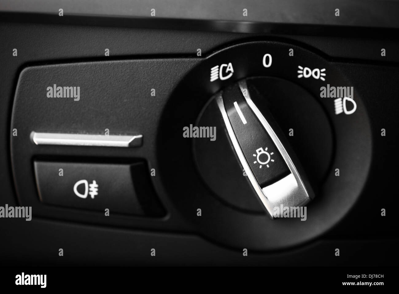 Detail of the headlight button in a car Stock Photo