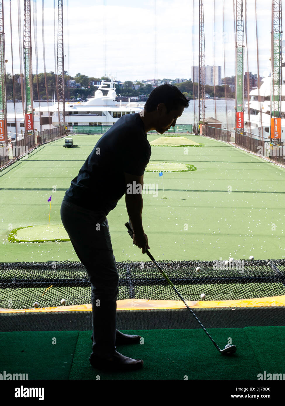 Golfer Practicing Swing.,The Golf Club at Chelsea Piers Sports ...
