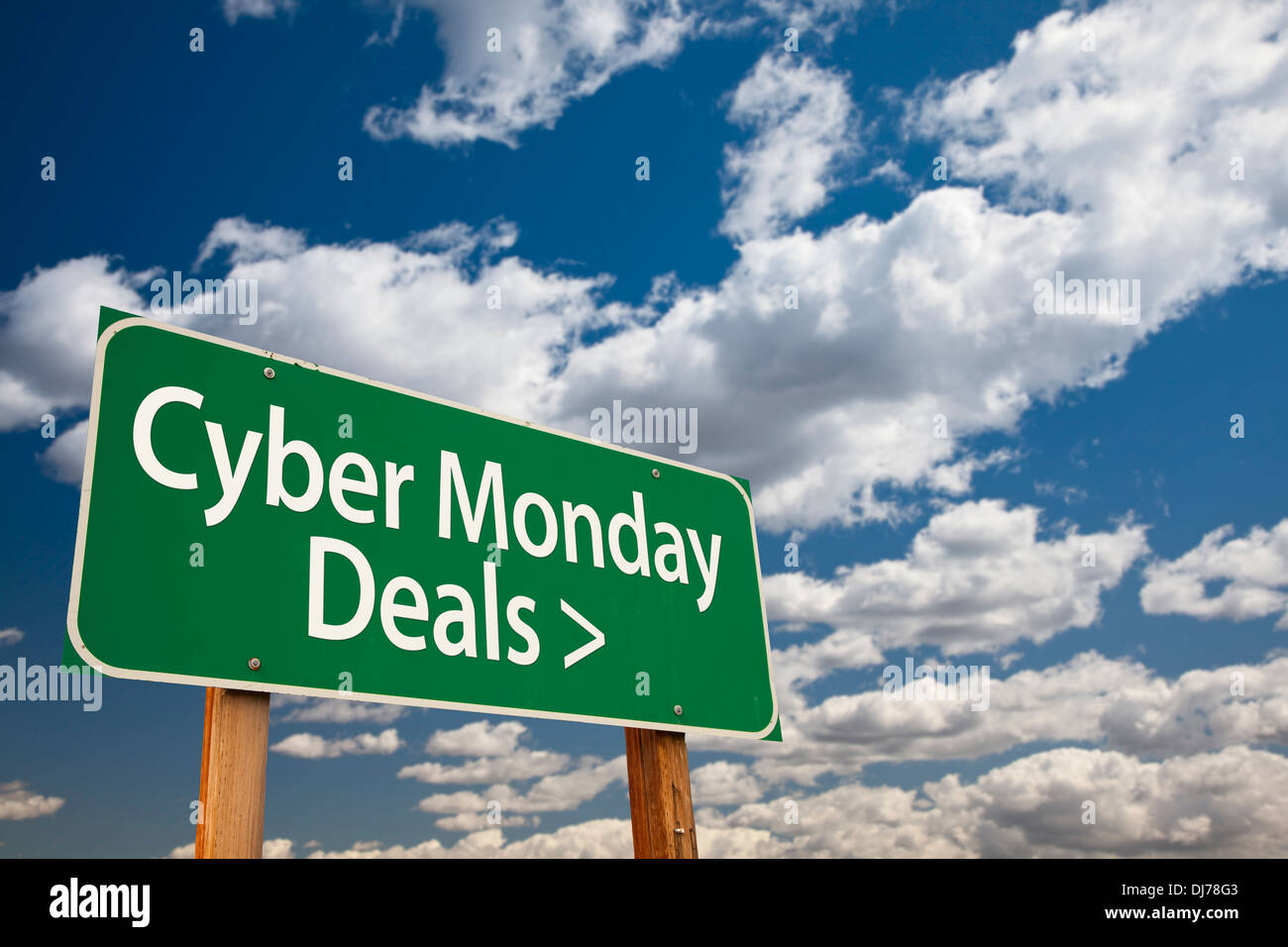 Cyber Monday Deals Green Road Sign with Dramatic Clouds and Sky Stock