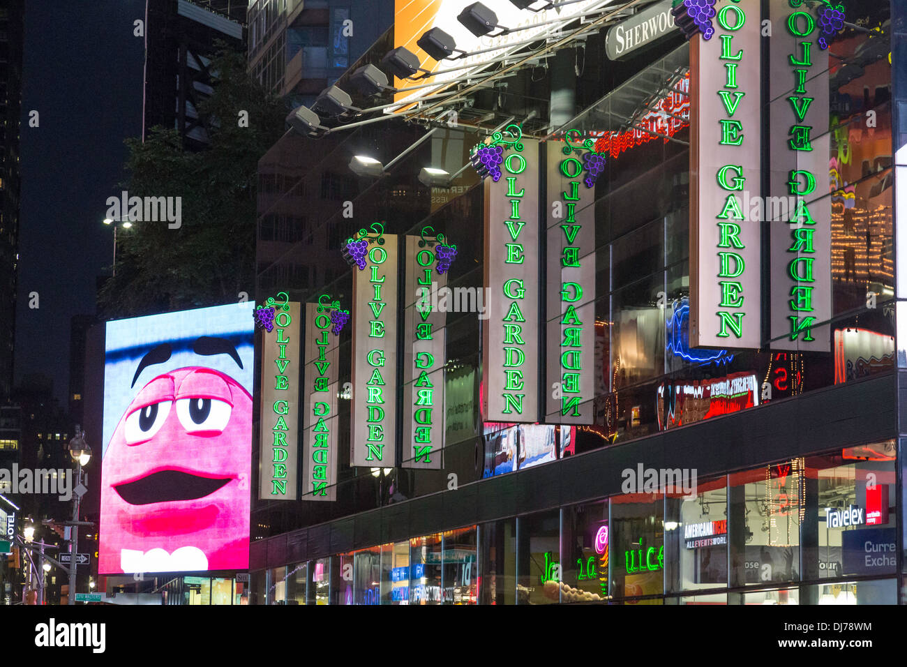 M&M Store Ad and Olive Garden Italian Restaurant in Times Square, NYC  2013 Stock Photo
