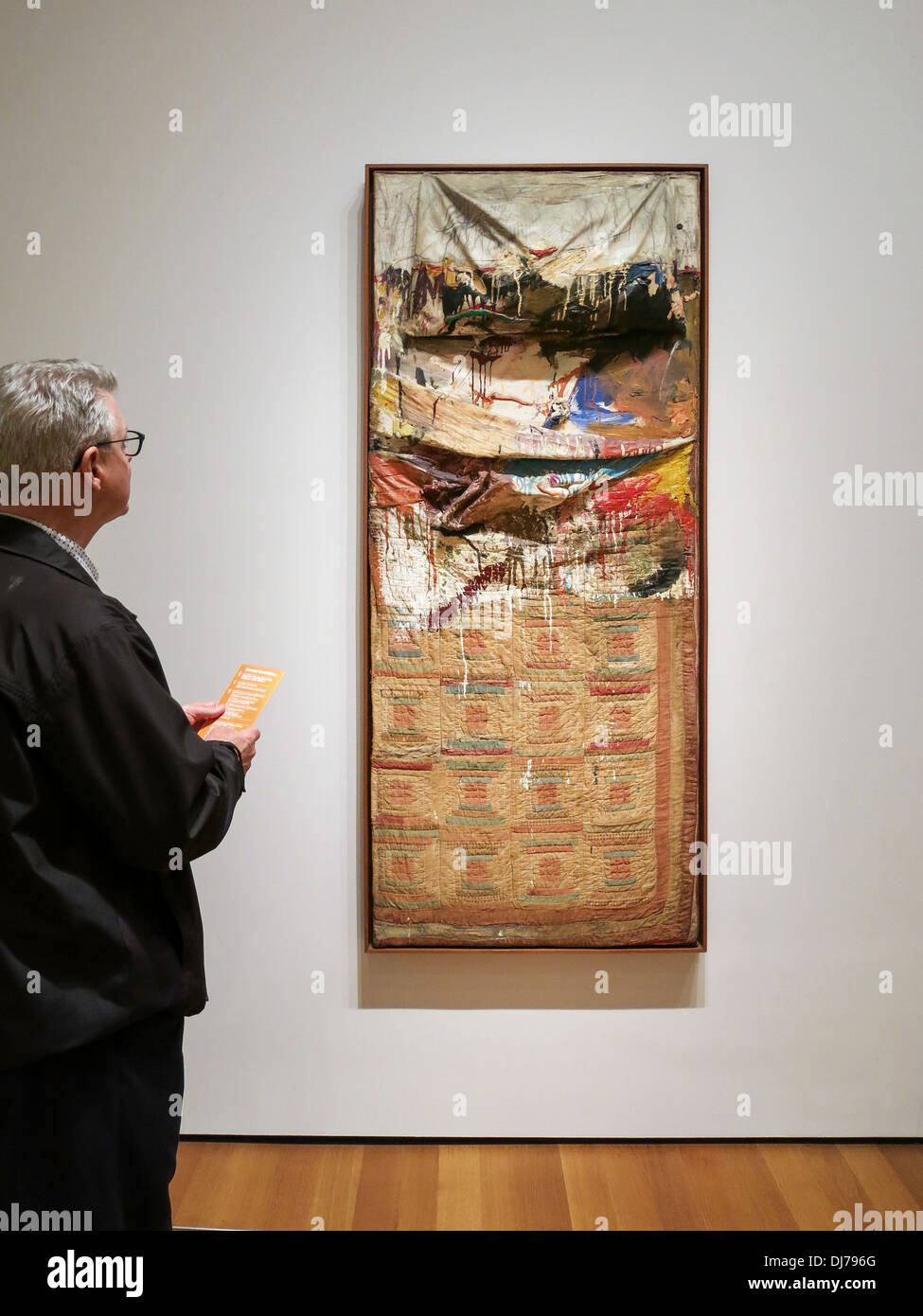 Male Patron Viewing 'Bed', Painting by Robert Rauschenberg, Museum of Modern Art, NYC Stock Photo