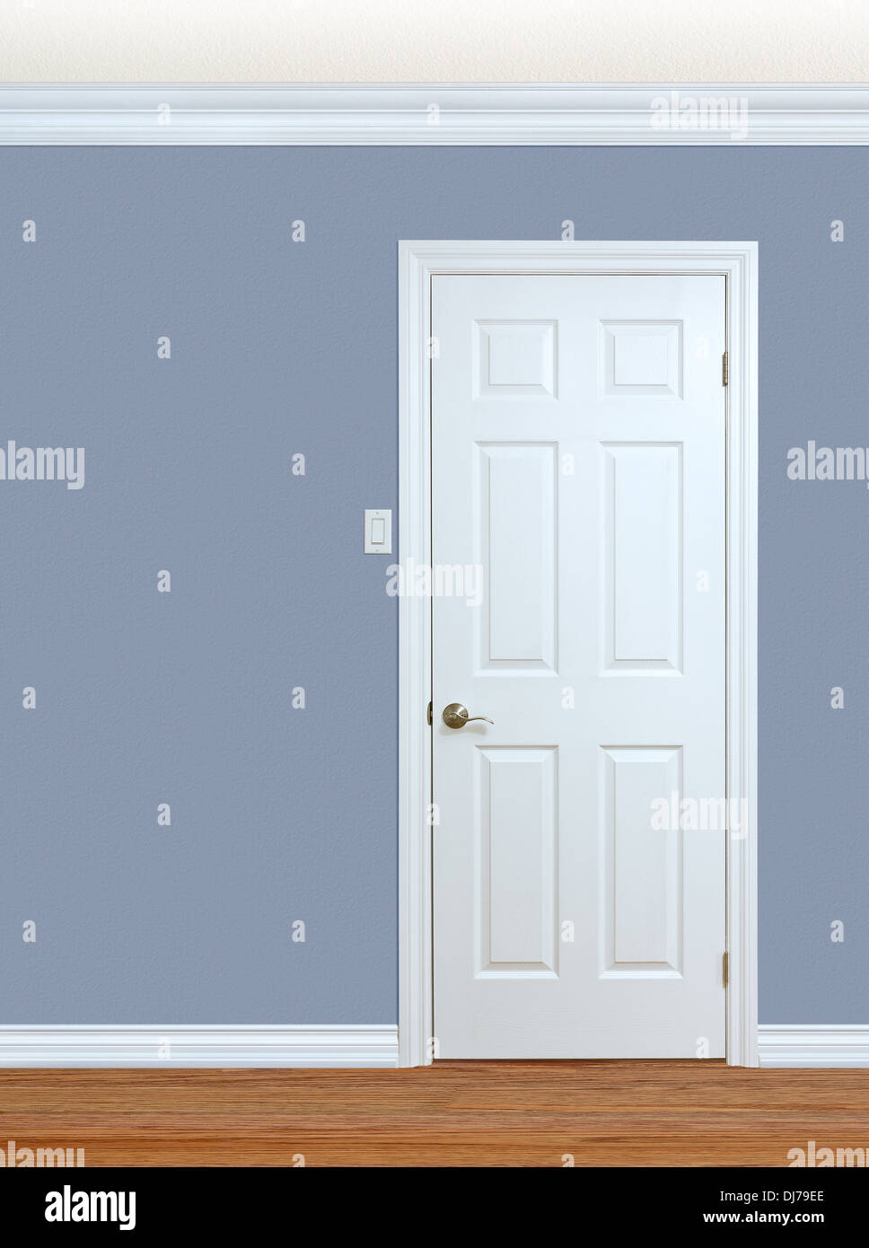Bedroom wall with door, baseboard and crown molding with room for text Stock Photo