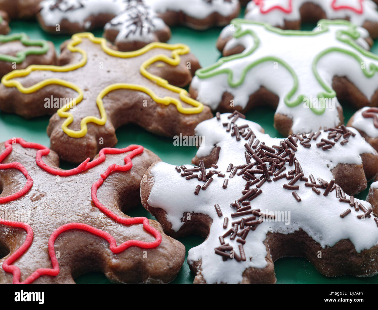 Star-shaped seasonal gingerbread cookies with icing Stock Photo
