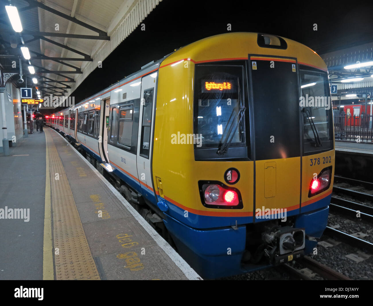 South West London Overground train, at Clapham Junction, at night no 378202 England UK Stock Photo