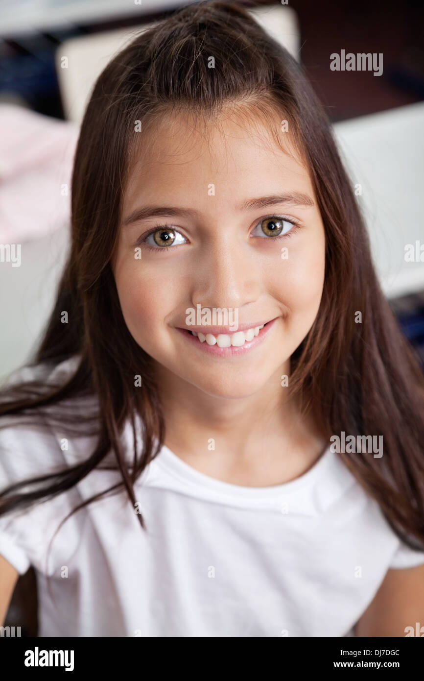 Closeup Of Schoolgirl Smiling In Classroom Stock Photo - Alamy