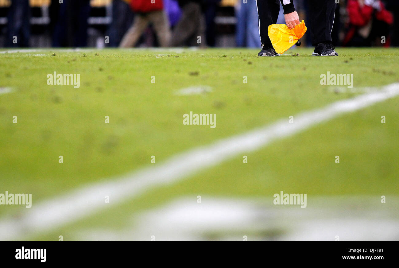 Baton Rouge, Louisiana, USA. 23rd Nov, 2013. November 23, 2013: An official picks up a penalty flag during the first half of the NCAA Football game between the LSU Tigers and the Texas A&M Aggies at Tiger Stadium in Baton Rouge, Louisiana. Credit:  csm/Alamy Live News Stock Photo