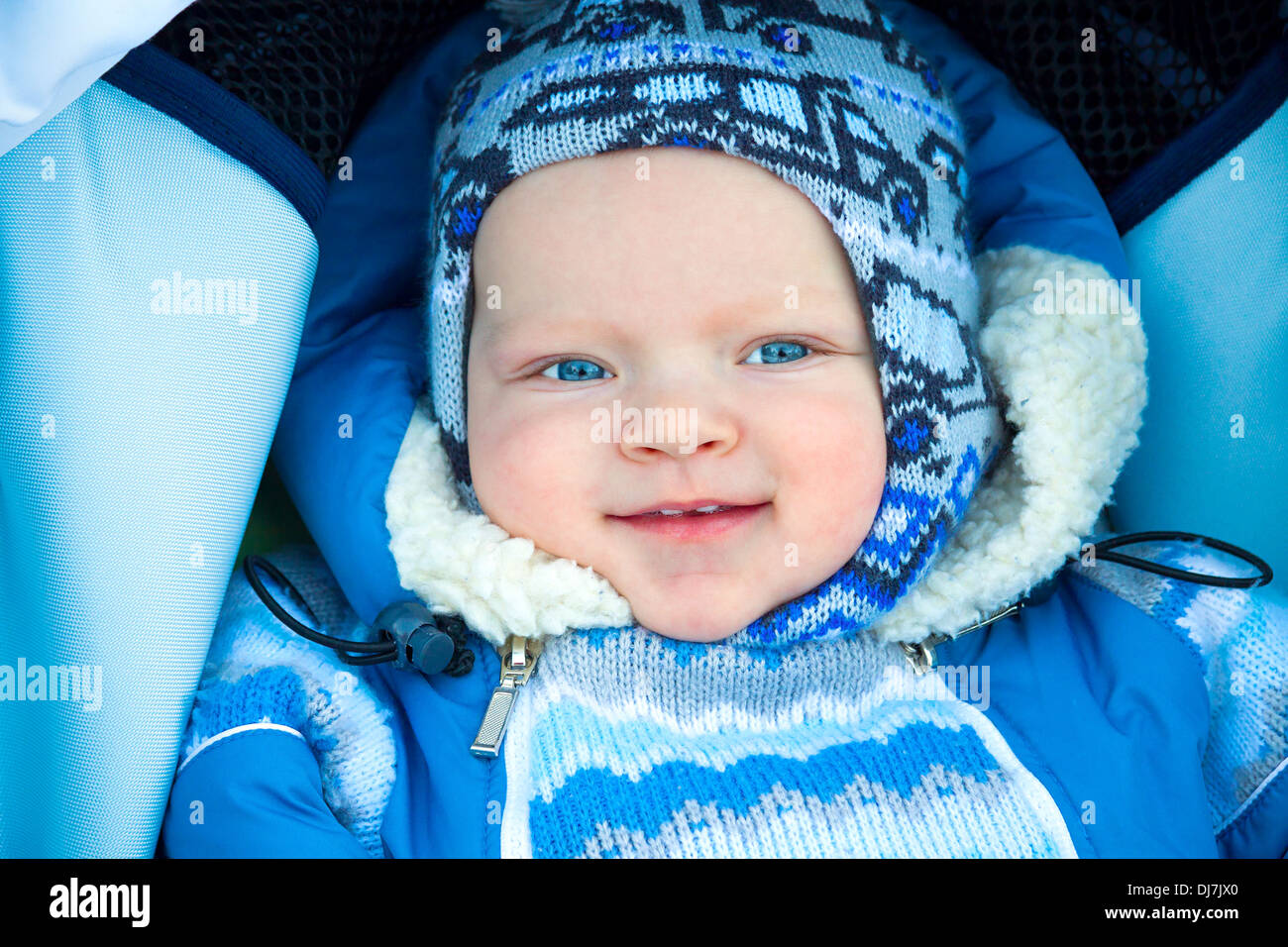 the happy small child in the winter on walk Stock Photo
