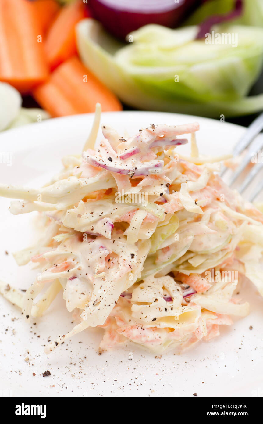 Carrot, cabbage and onion coleslaw. Spiced with black pepper. Stock Photo