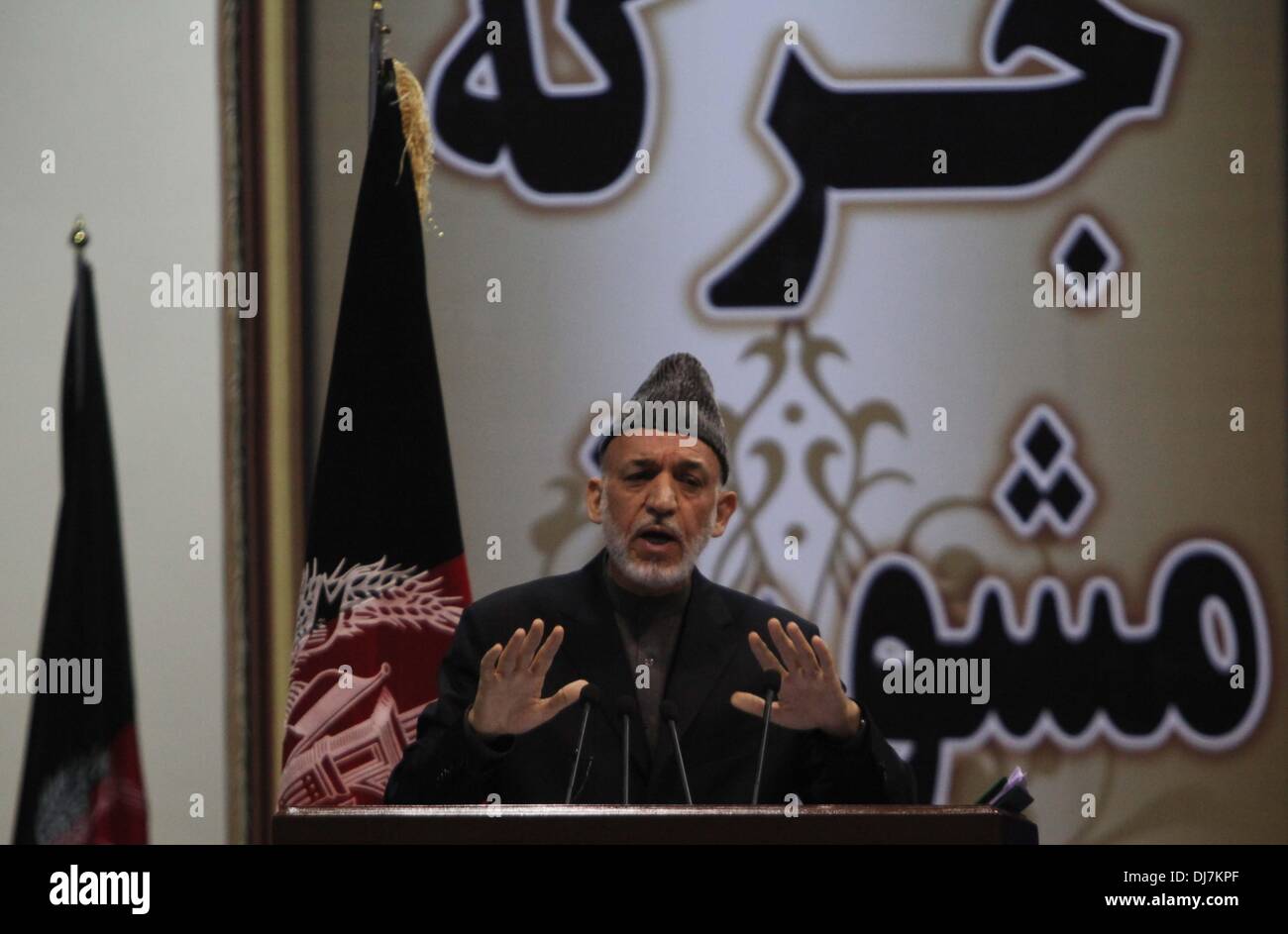 Afghanistan, Kabul. 24 Nov 2013. Afghan president Hamid Karzai speaks during Loya Jirga in Kabul, Afghanistan, on Nov. 24, 2013. Afghanistan's traditional Loya Jirga or grand assembly of tribal elders and notables approved after four-day debates a security pact known as Bilateral Security Agreement (BSA) with the United States on Sunday, deputy to the Jirga Abdul Karim Aymaq said while reading out the resolution issued at the end of the Jirga.  (Xinhua/Ahmad Massoud) (lyx) Stock Photo