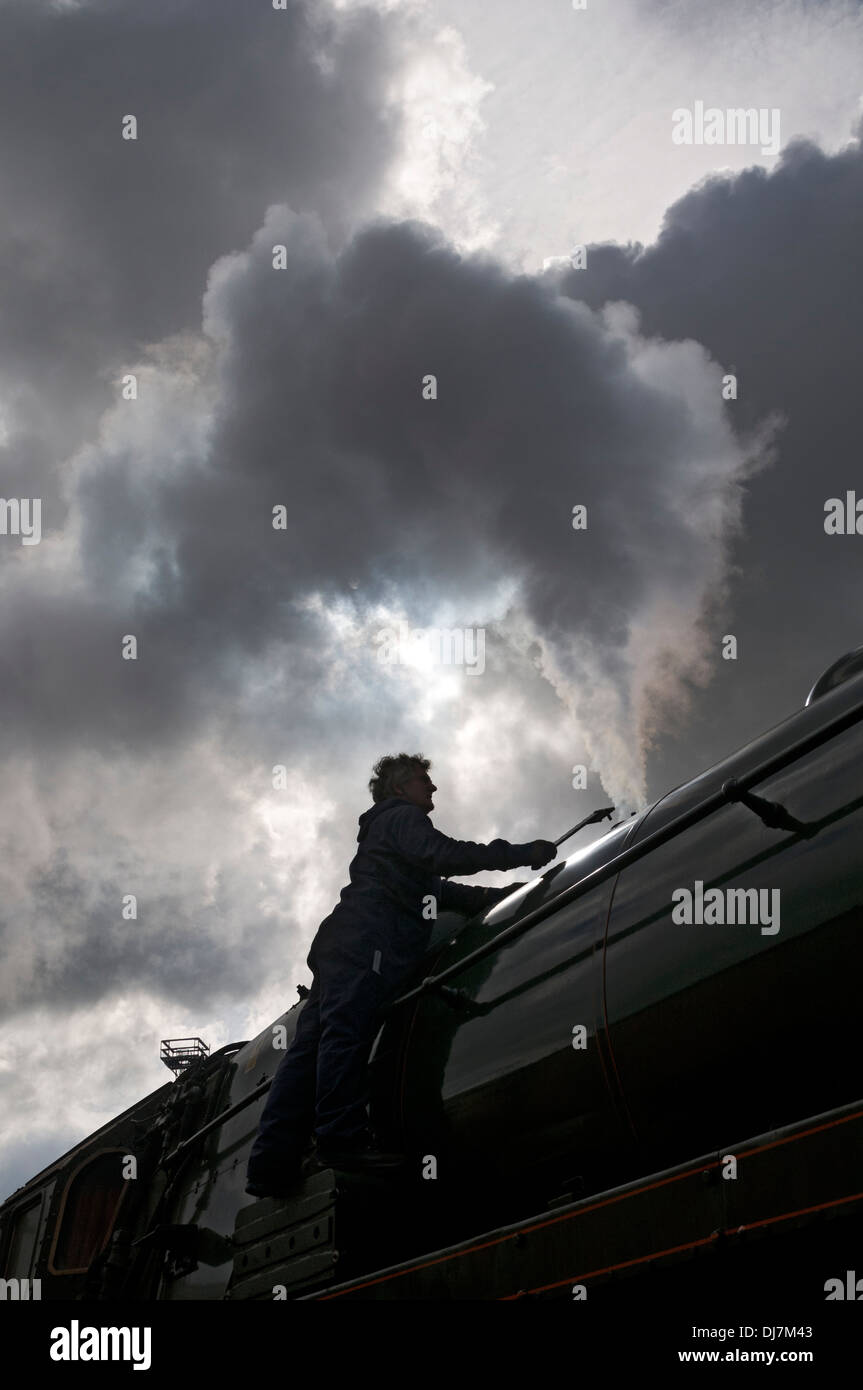 Technician adjusting the pressure relief safety valve on a steam