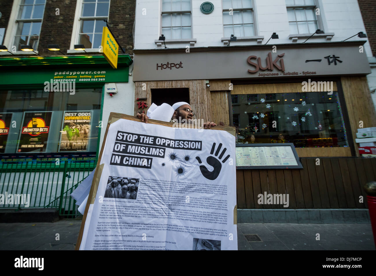 U.K. based Islamists protested in London’s Chinatown to raise awareness of the on-going oppression of Muslims in China. Stock Photo