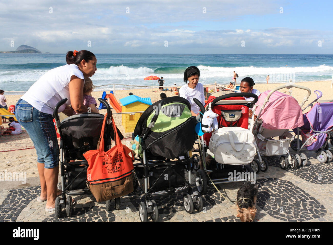 Brazilian maids with prams on Leblon beach, Rio de Janeiro, Brazil Stock Photo