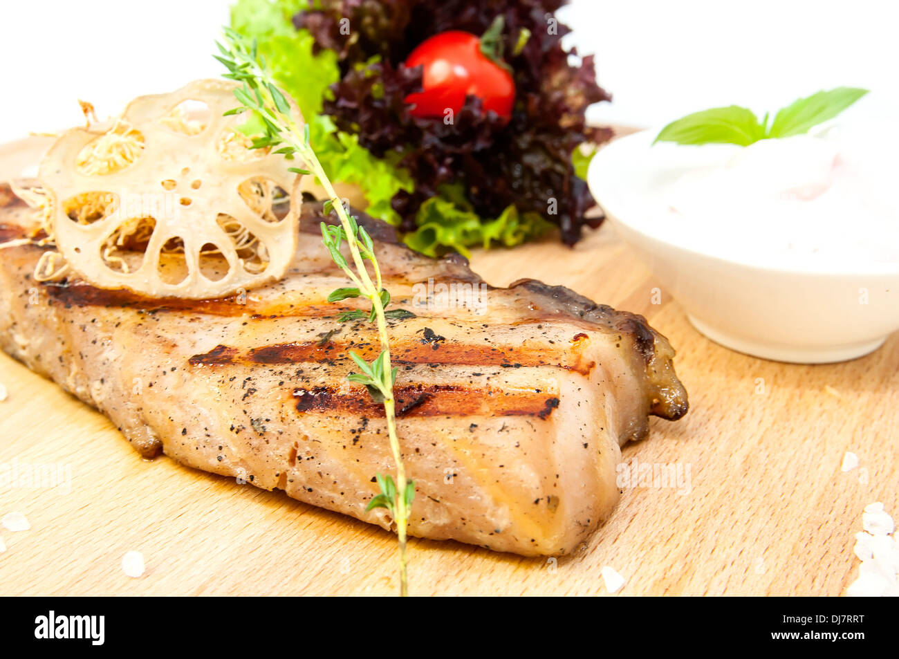 Catfish steak cooking on a grill in the restaurant Stock Photo Alamy
