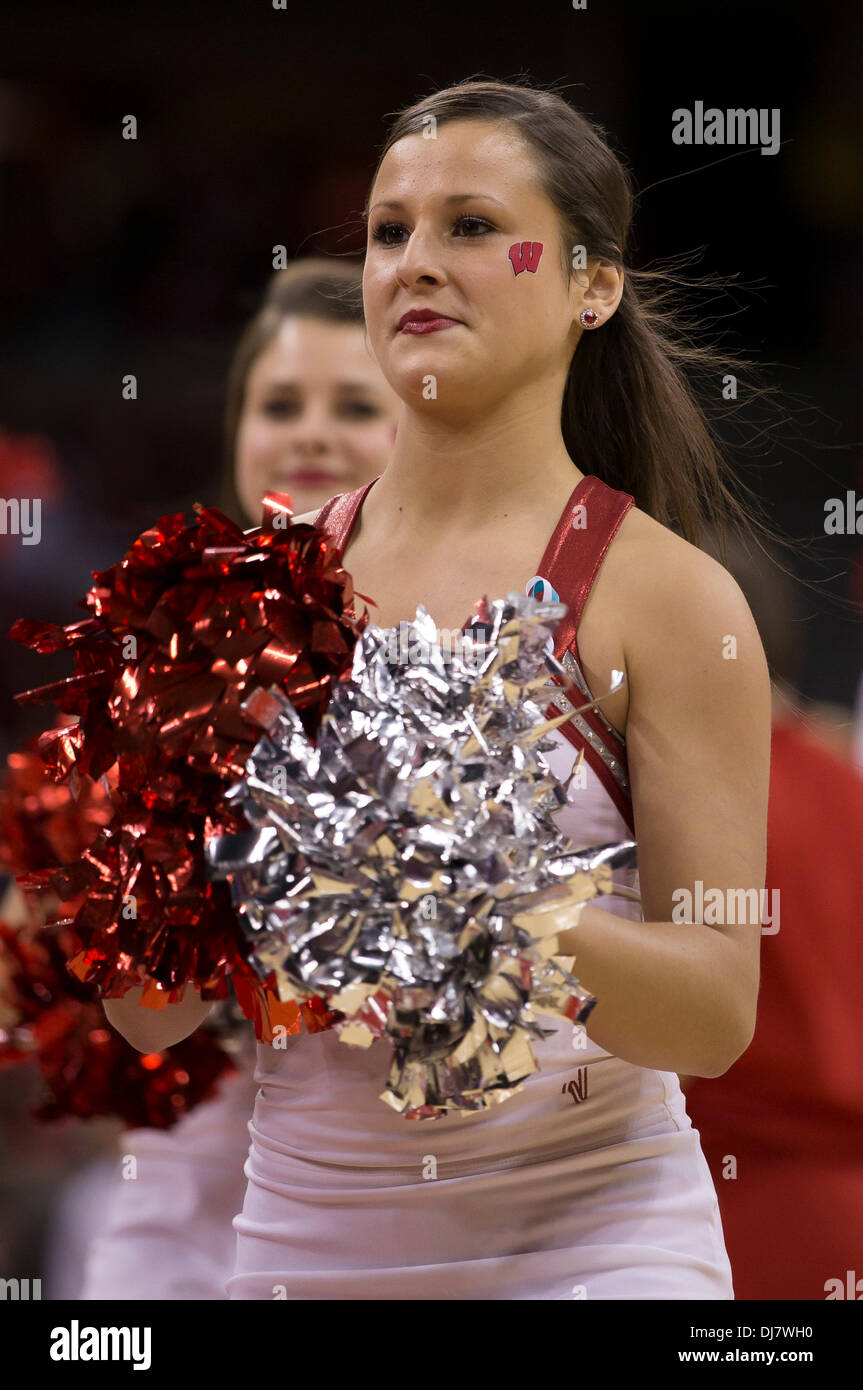 Madison, Wisconsin, USA. 23rd Nov, 2013. November 23, 2013: Wisconsin Badgers cheerleader entertains the Kohl Center crowd during the NCAA Basketball game between the Oral Roberts Golden Eagles and the Wisconsin Badgers at the Kohl Center in Madison, WI. Wisconsin defeated Oral Roberts 76-67. John Fisher/CSM/Alamy Live News Stock Photo