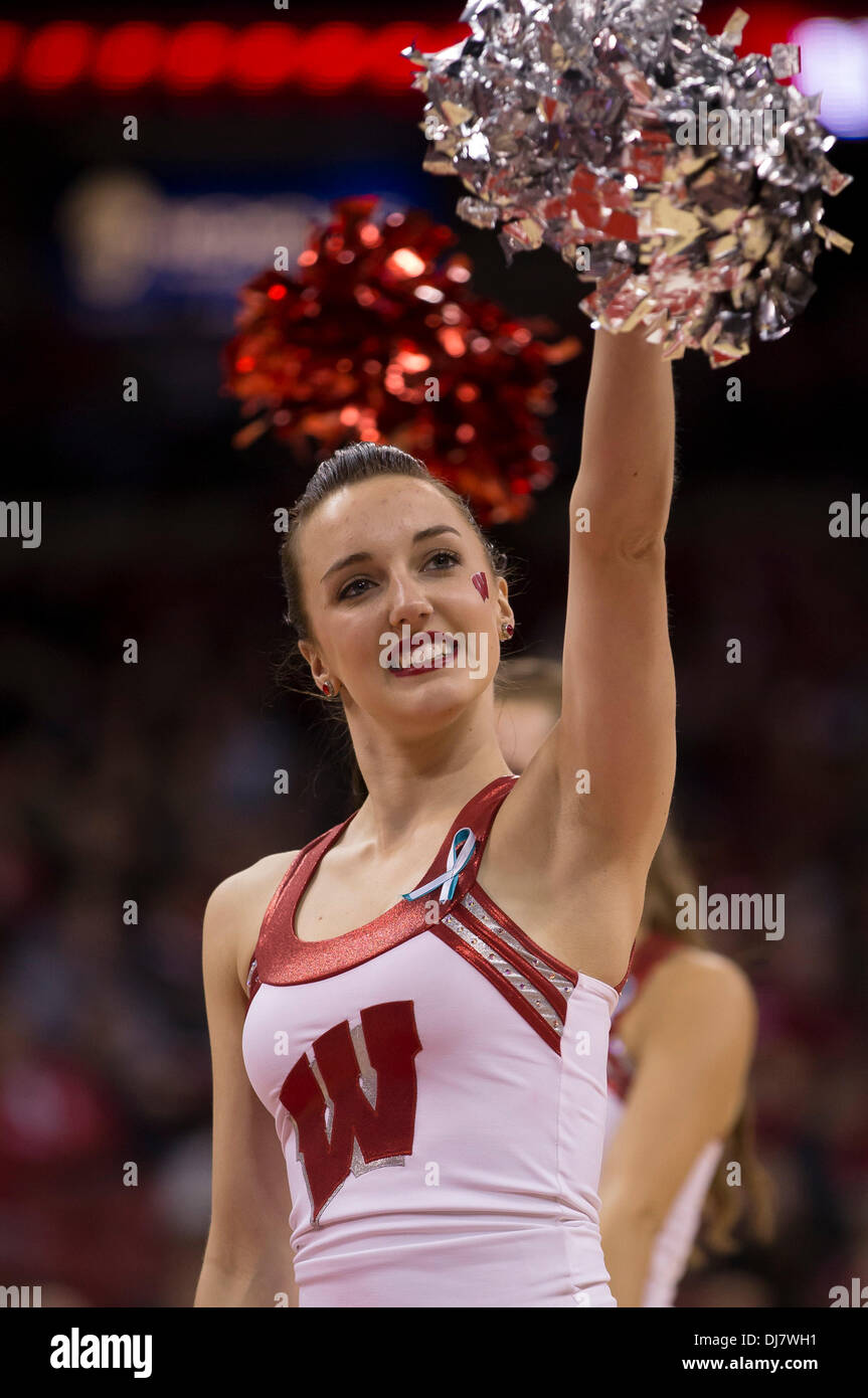 Madison, Wisconsin, USA. 23rd Nov, 2013. November 23, 2013: Wisconsin Badgers cheerleader entertains the Kohl Center crowd during the NCAA Basketball game between the Oral Roberts Golden Eagles and the Wisconsin Badgers at the Kohl Center in Madison, WI. Wisconsin defeated Oral Roberts 76-67. John Fisher/CSM/Alamy Live News Stock Photo