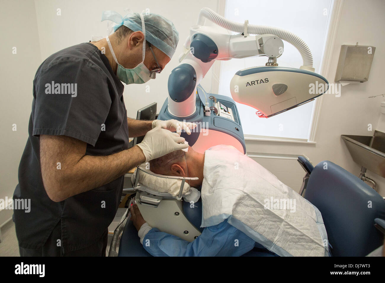 ARTAS robotic hair transplant machine being used at Farjo Hair Institute on Quay Street in Manchester Stock Photo