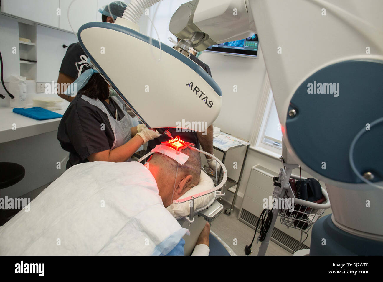 ARTAS robotic hair transplant machine being used at Farjo Hair Institute on  Quay Street in Manchester Stock Photo - Alamy