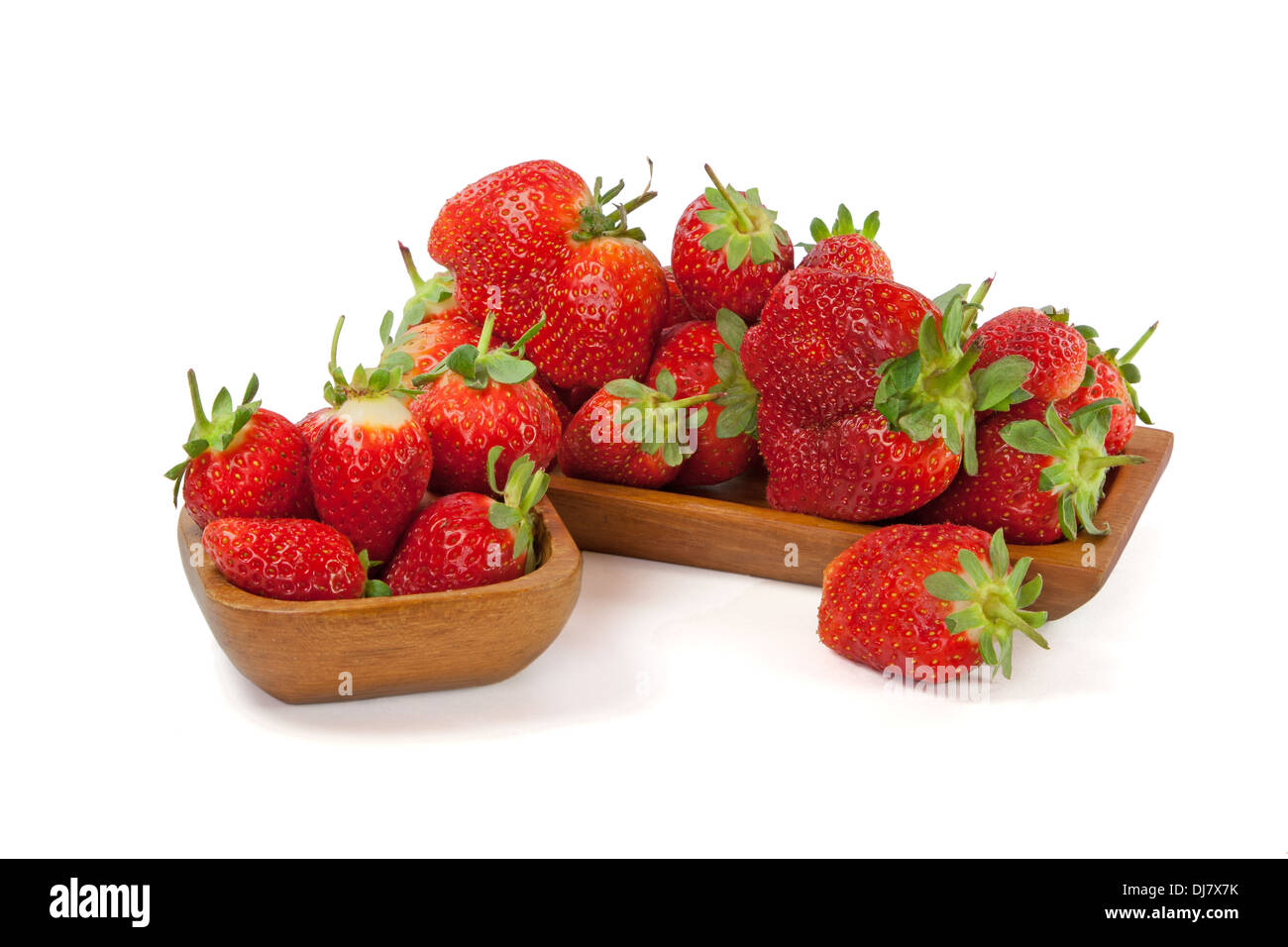 Strawberries in a wooden bowl isolated on white background Stock Photo ...