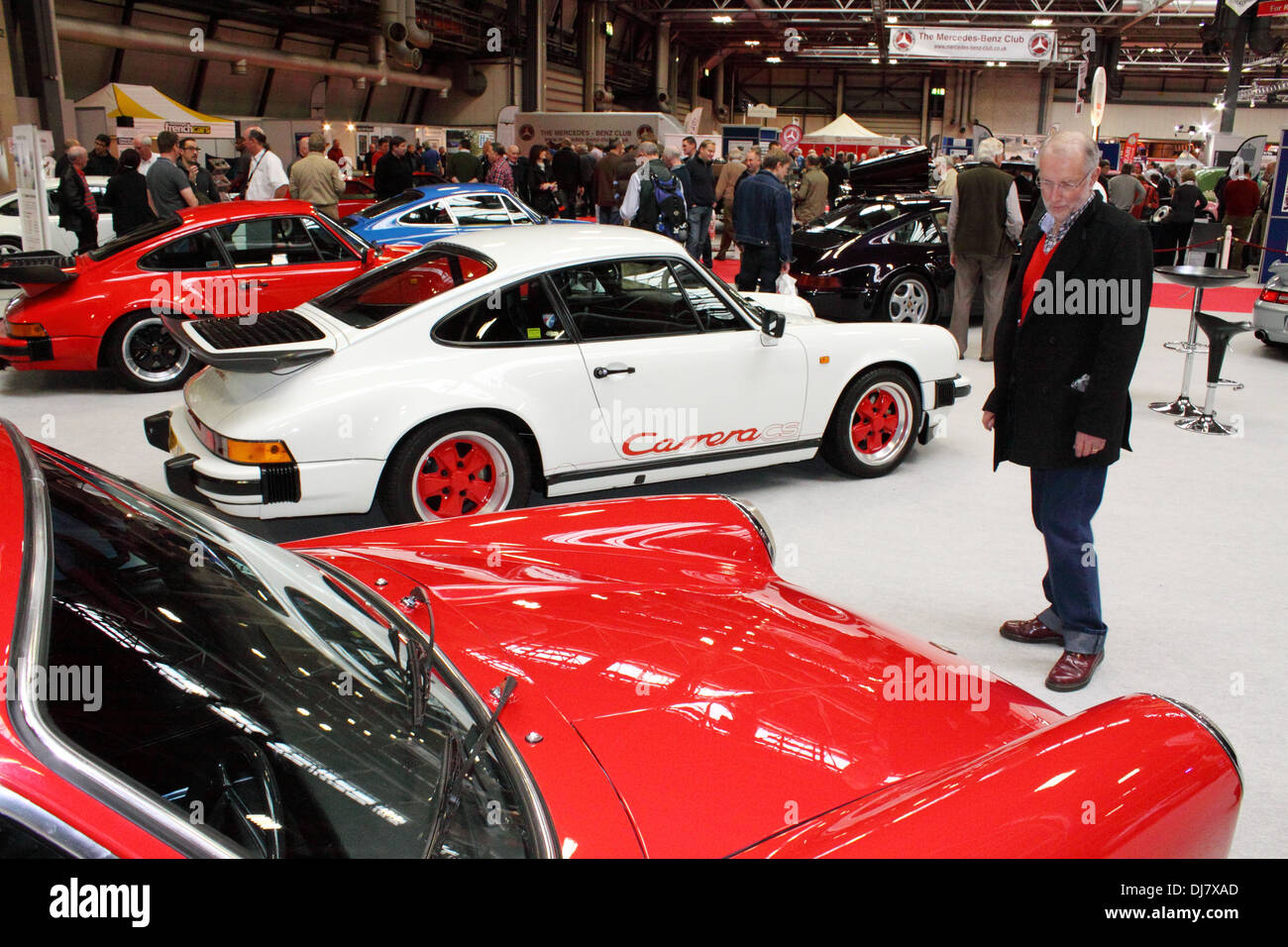 Middle-aged man admiring classic Porsche 911's at the 2013 Birmingham NEC Classic Car Show Stock Photo