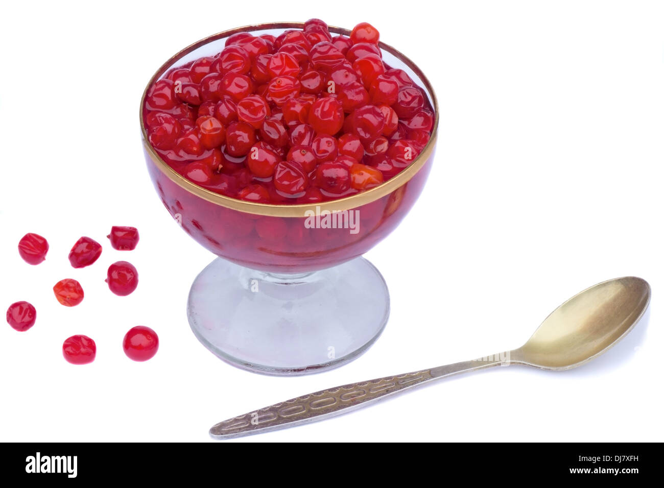 Bright red berries in a crystal vase filled with sugar syrup. Presented