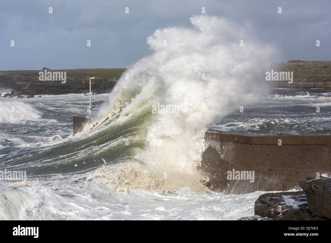 Storm wave crashing over harbour wall, Doolin, Co. Clare, Ireland Stock Photo