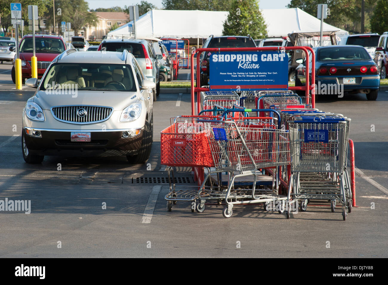 Shopping cart return area in an American supermarket car park Stock