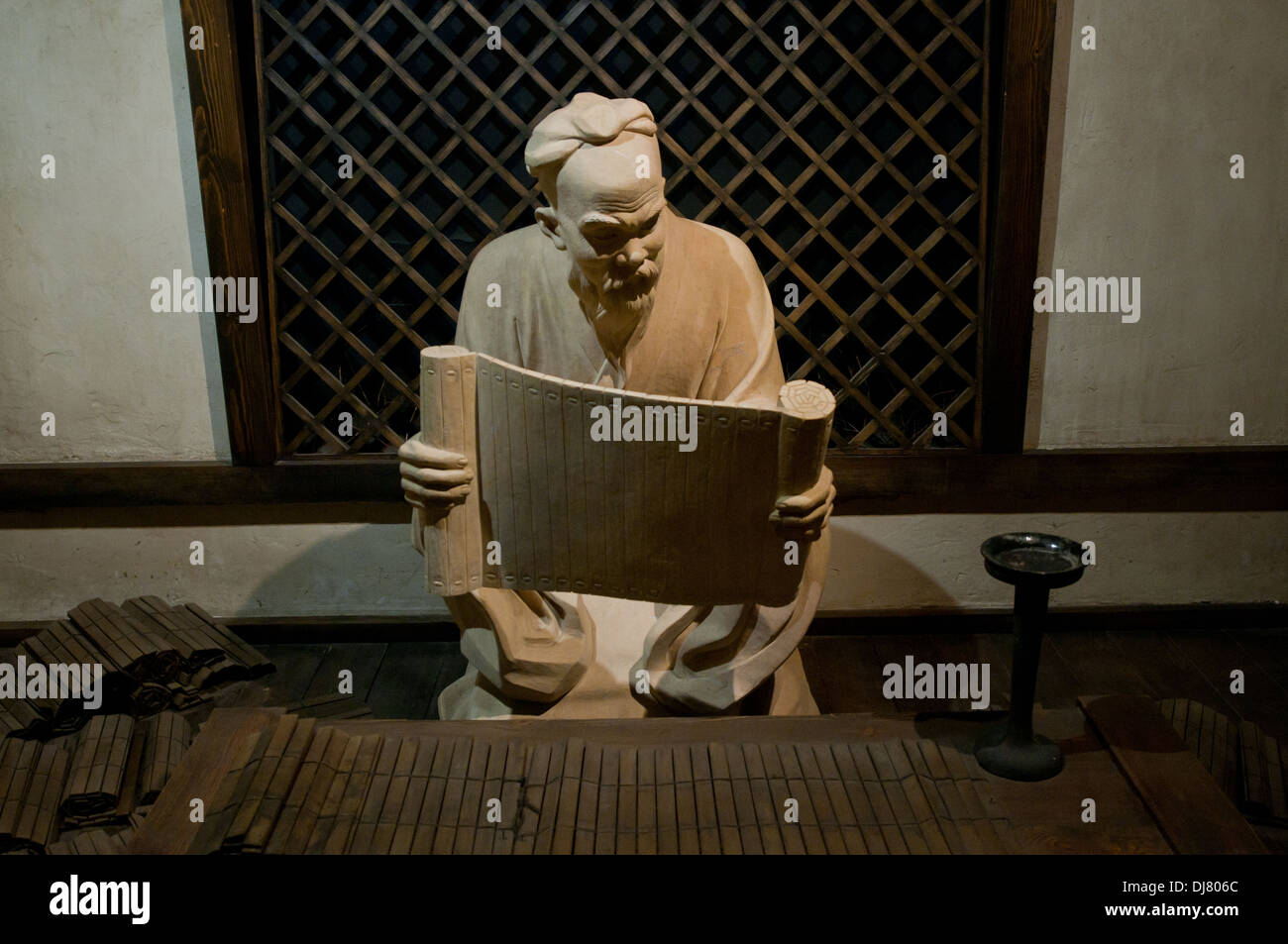 Confucius reading Book of Changes statue in The Temple of Confucius at Guozijian Street in Beijing, China Stock Photo