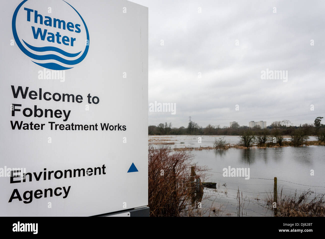 Thames Water Treatment Works / Environment Agency next to flooded field, Reading, Berkshire, England, UK. Stock Photo