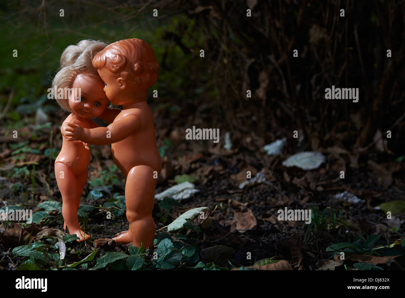 Couple baby dolls boy and girl have sex in park at night Stock  