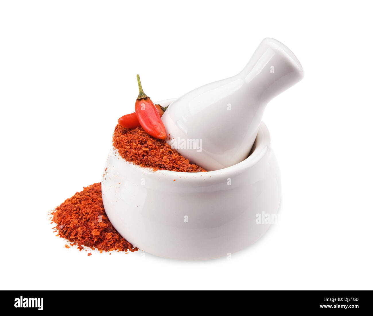 Crushed Chillies in the white ceramic mortar isolated Stock Photo