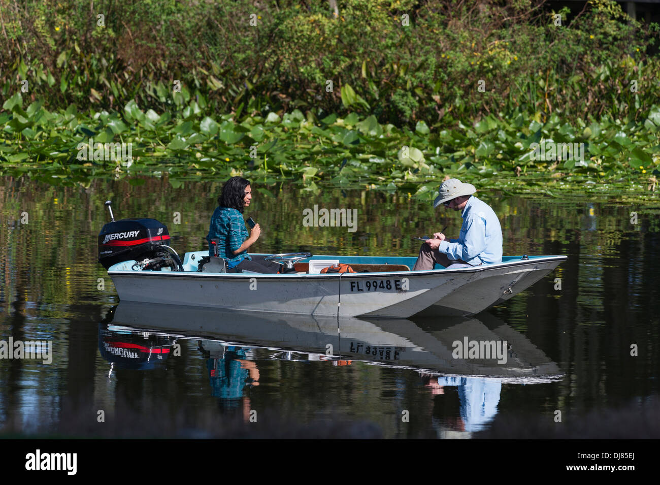 A couple boating on Haines Creek in Lake county Florida, USA Stock Photo