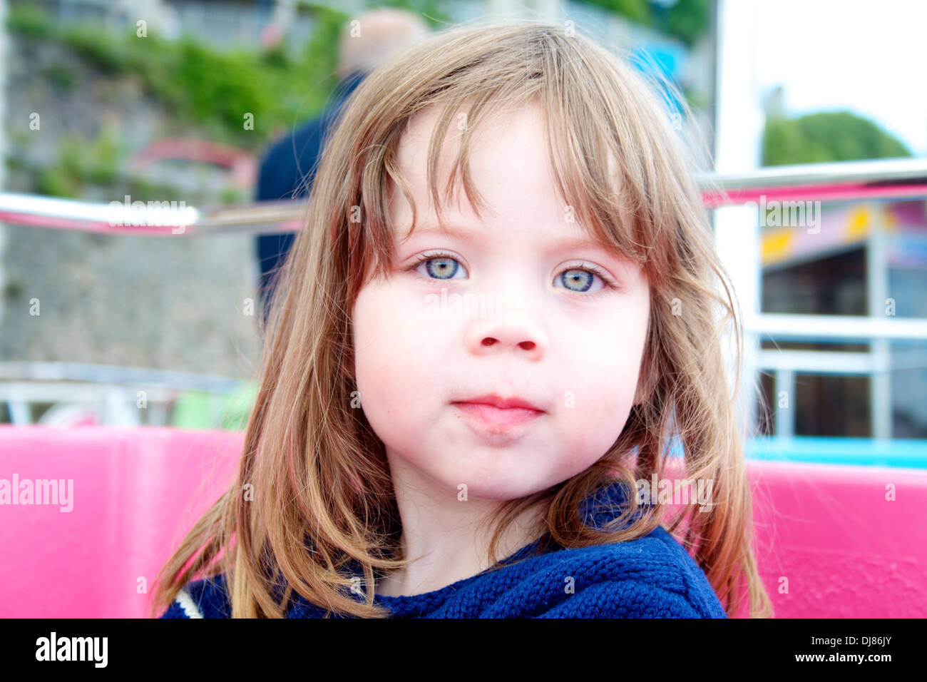 A young girl on a fairground ride Stock Photo