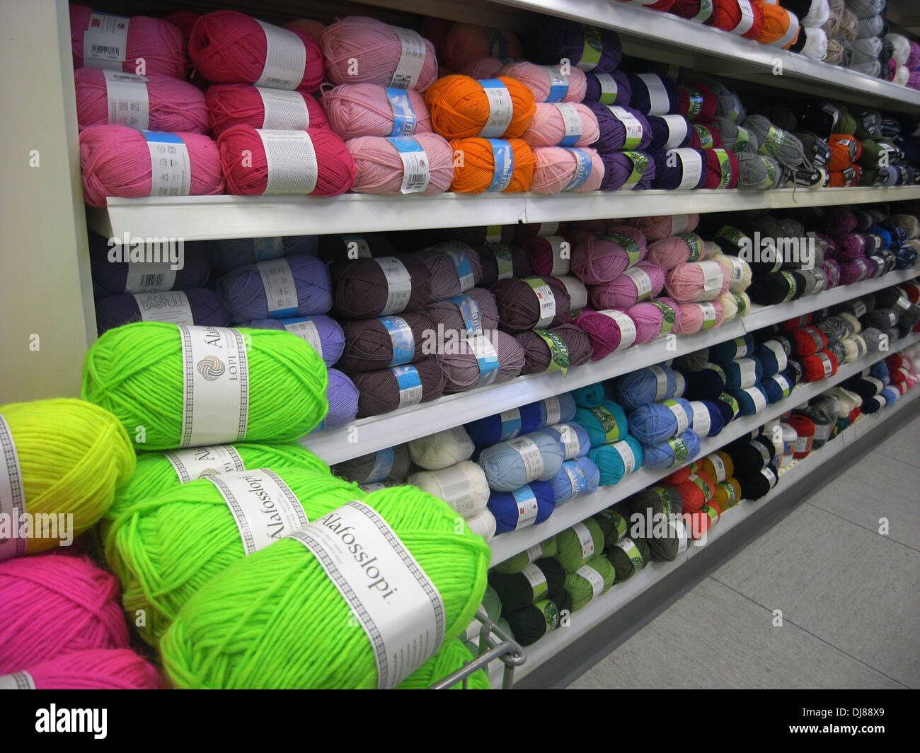 Large quantities of wool or yarn for knitting available in Iceland supermarket aisle Stock Photo