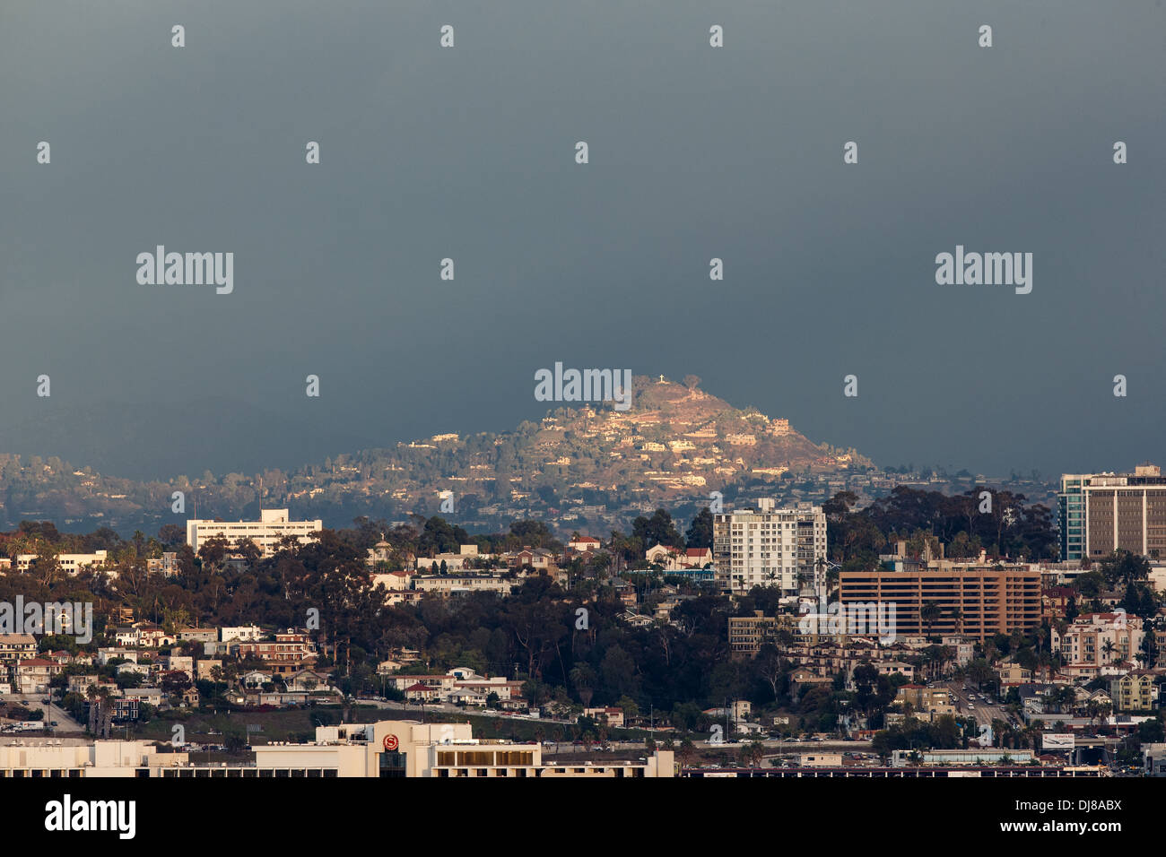 A view of Hillcrest and Balboa Park in San Diego, Mount Helix in La Mesa is lit by sun in the background. Stock Photo