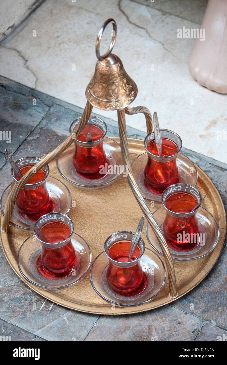 Turkish tea being served in traditional tulip glasses in the old town