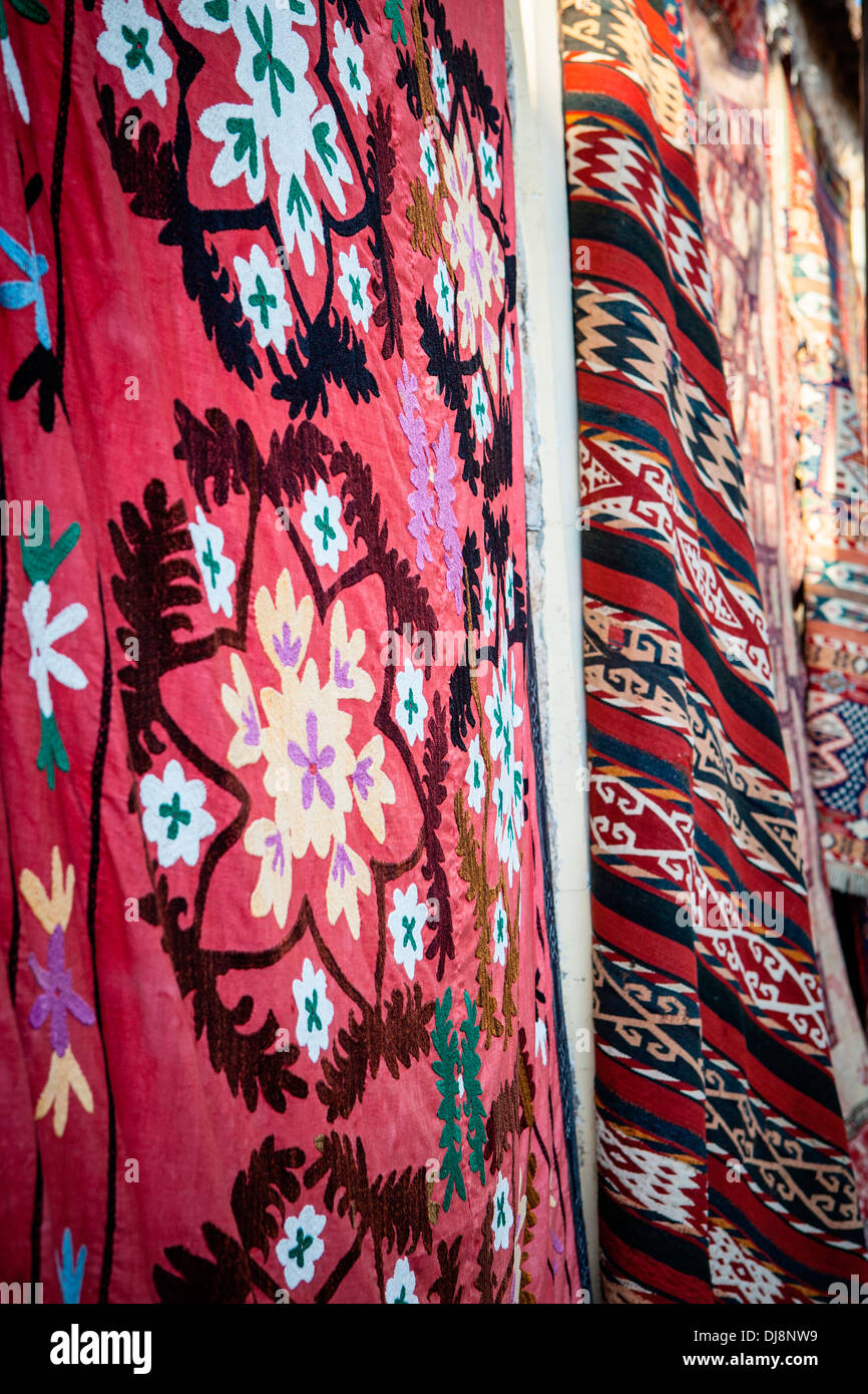 Colourful Turkish textiles are displayed in the old town of Antalya on ...