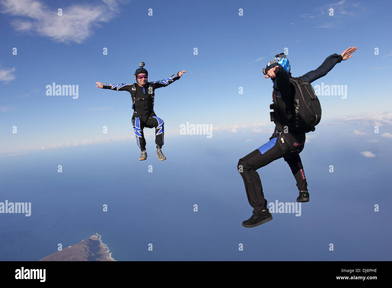 This freefly skydiving team is training together for the next competition. It is fun for all to fly free in the blue sky. Stock Photo