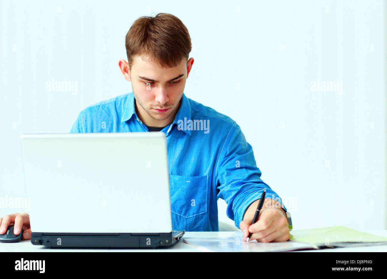 Concentrated businessman writing notes hi-res stock photography and ...