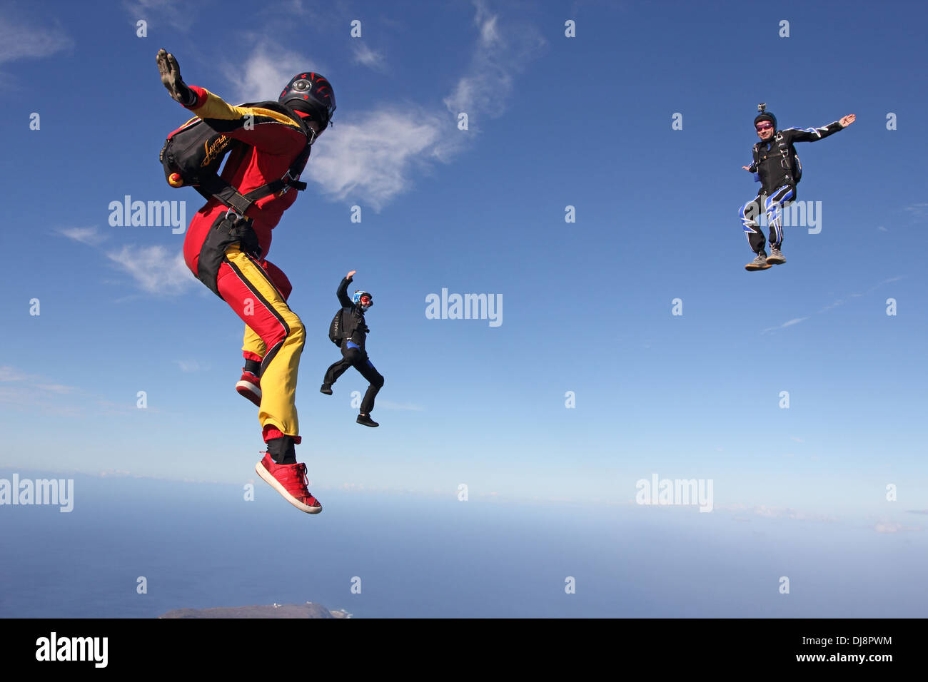 This freefly skydive team is training together for the next competition. It is fun for all to fly free in the blue sky. Stock Photo