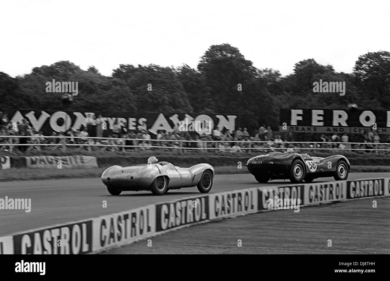 Peter Mould in a Lister Jaguar leading Alan Rees in a Lola Mk 1. British Grand Prix Silverstone England 16 July 1960. Stock Photo