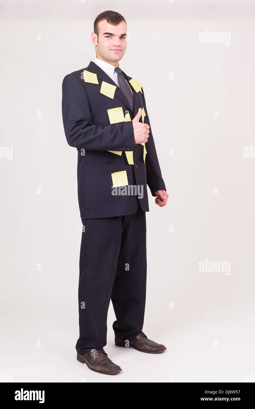 Forgetful businessman with sticky notes Stock Photo