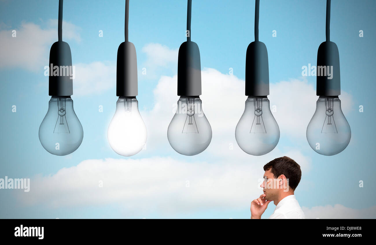 Thoughtful young businessman looking away Stock Photo