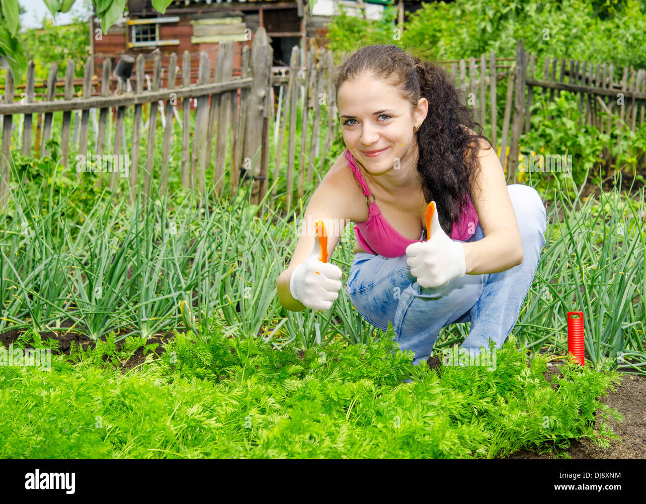 portrait of young beautiful woman in her garden Stock Photo - Alamy