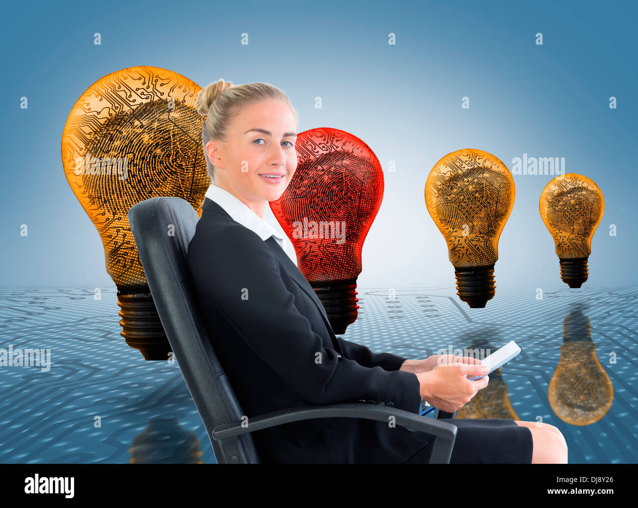 Businesswoman sitting on swivel chair with tablet Stock Photo