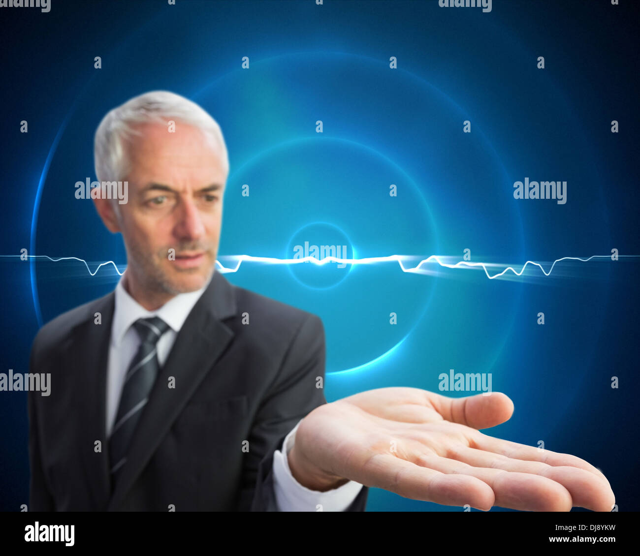 Concentrated businessman with palm up Stock Photo