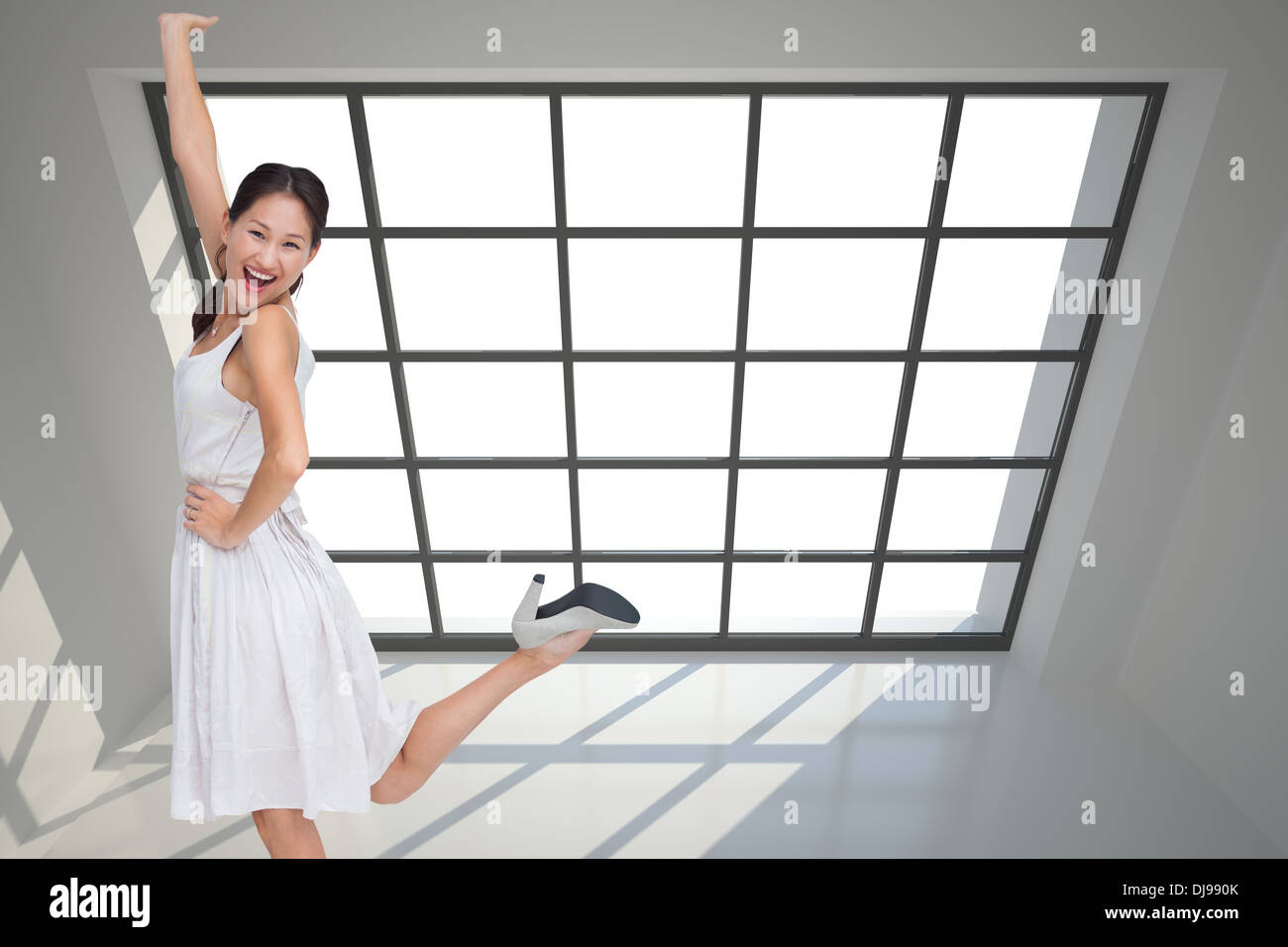 Composite image of happy and classy brunette posing Stock Photo