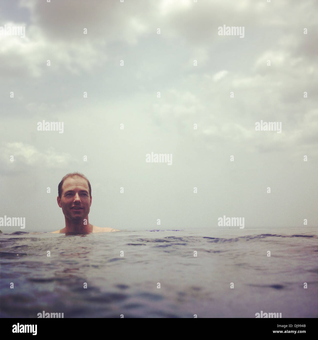 Man swimming in ocean - Smartphone Captured Stock Image