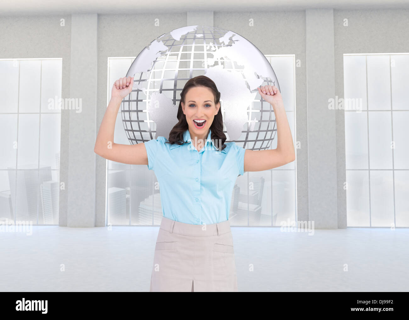 Composite image of victorious stylish businesswoman posing Stock Photo